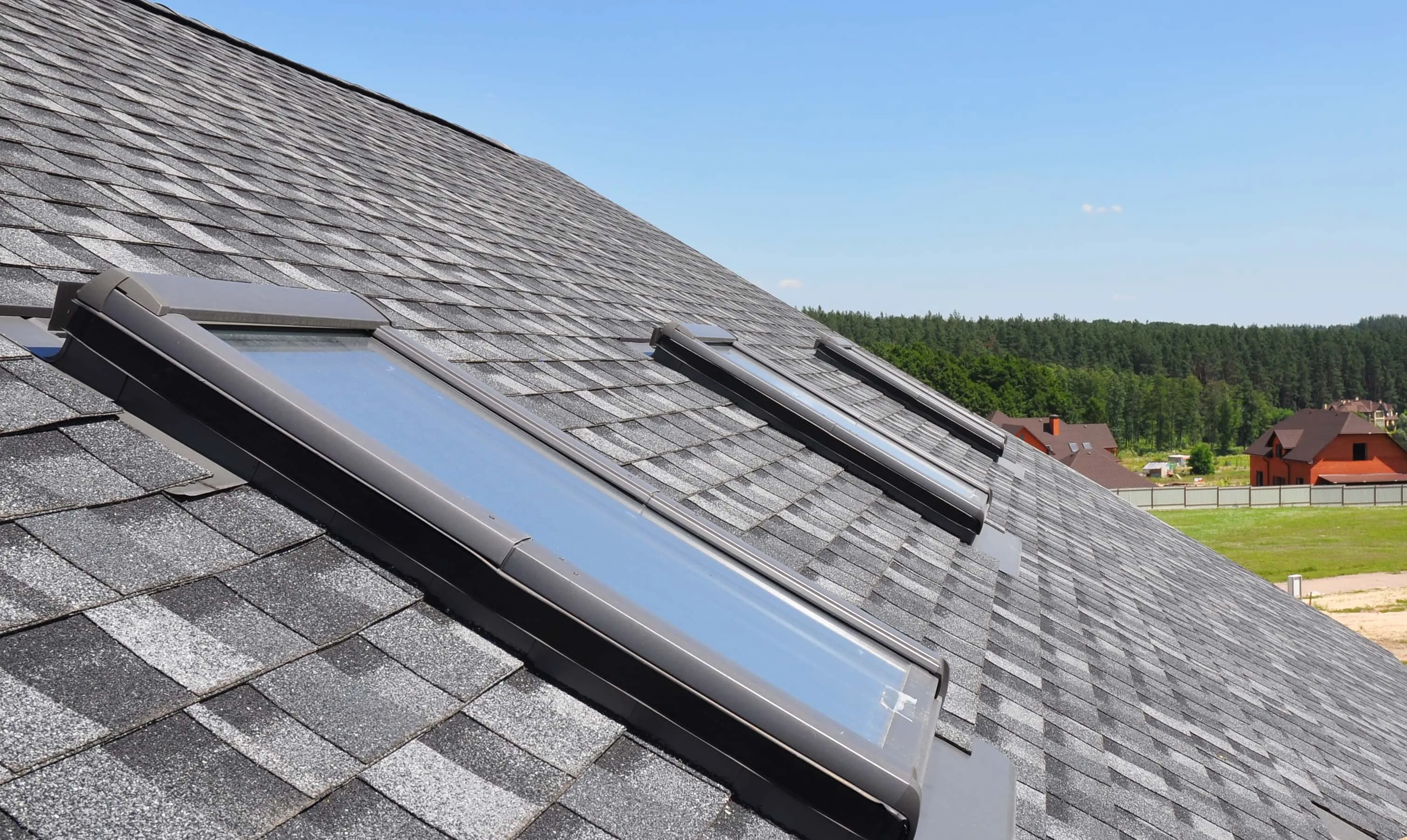Roofer installing a skylight on a Grand Rapids home